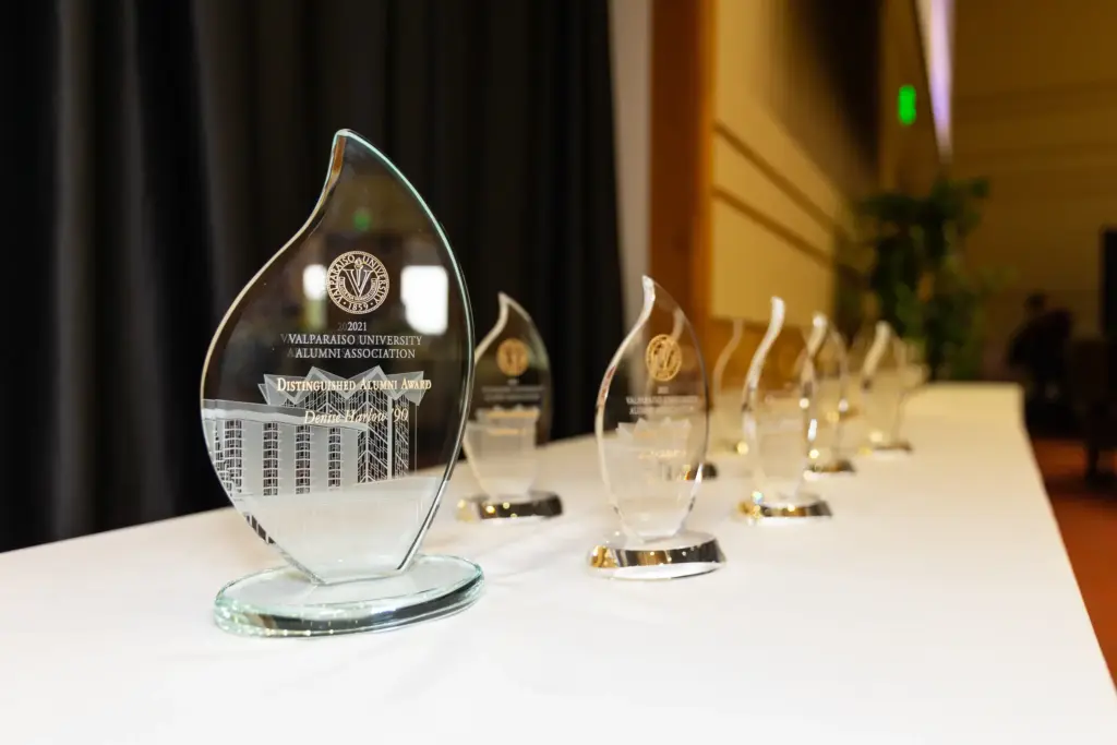 Alumni awards, translucent, on a white tablecloth-covered table